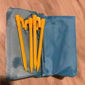 Waterproof picnic blanket, lightweight, foldable compact blanket with stakes